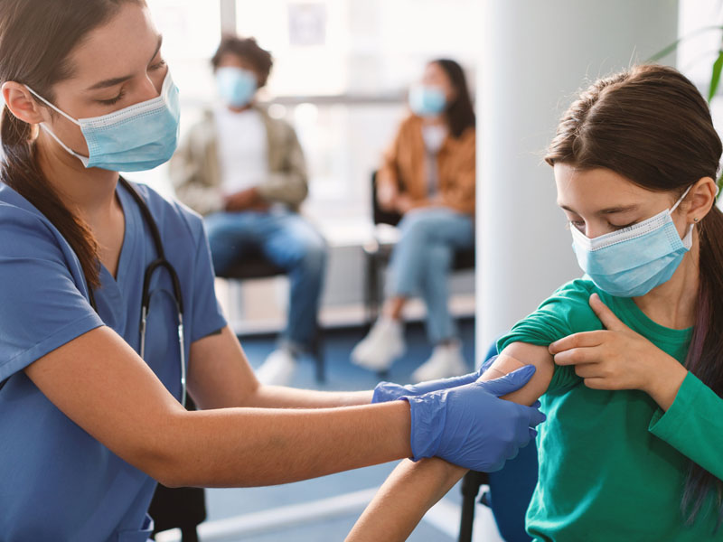 Girl Getting Vaccinated Against Covid-19, Doctor Applying Plaster thumbnail